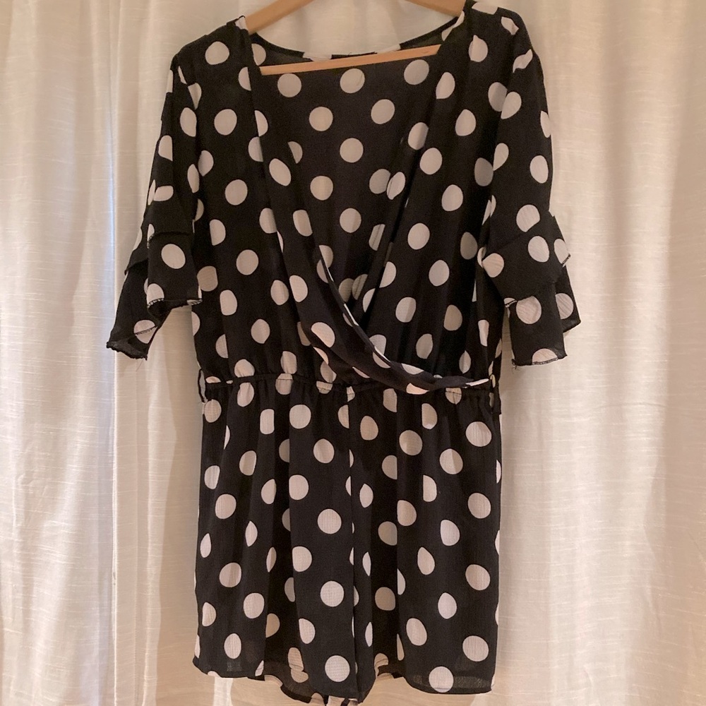 Black w/ White Polka dot Romper. Ruffle Sleeves.